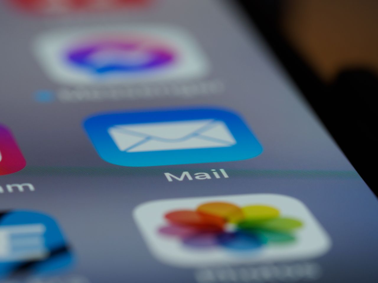 about-us Detailed close-up of an email app icon on a smartphone screen, showcasing modern technology.